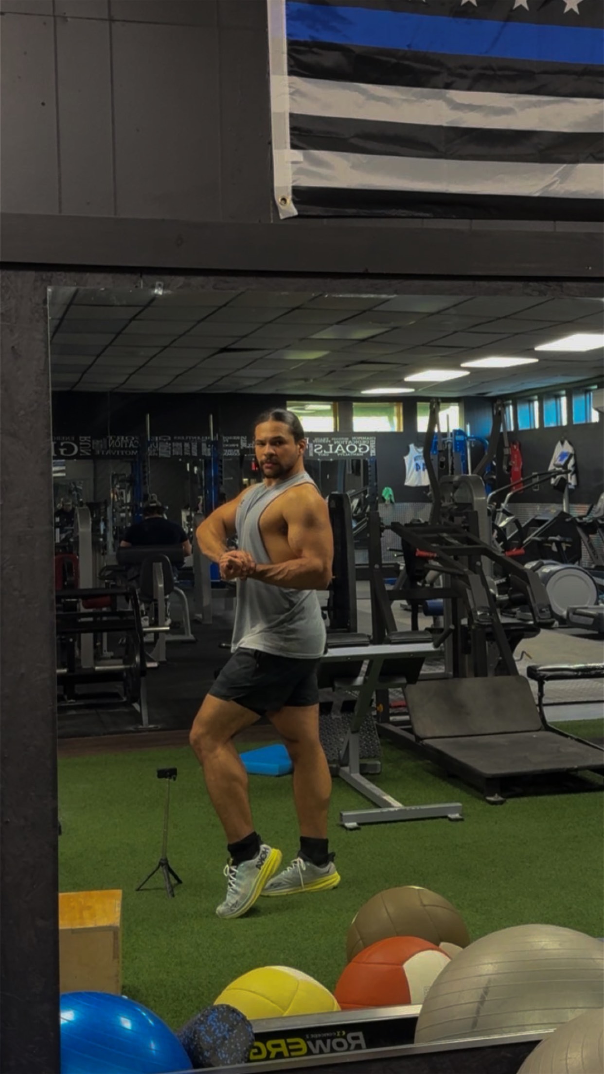 Jayden posing in the gym
