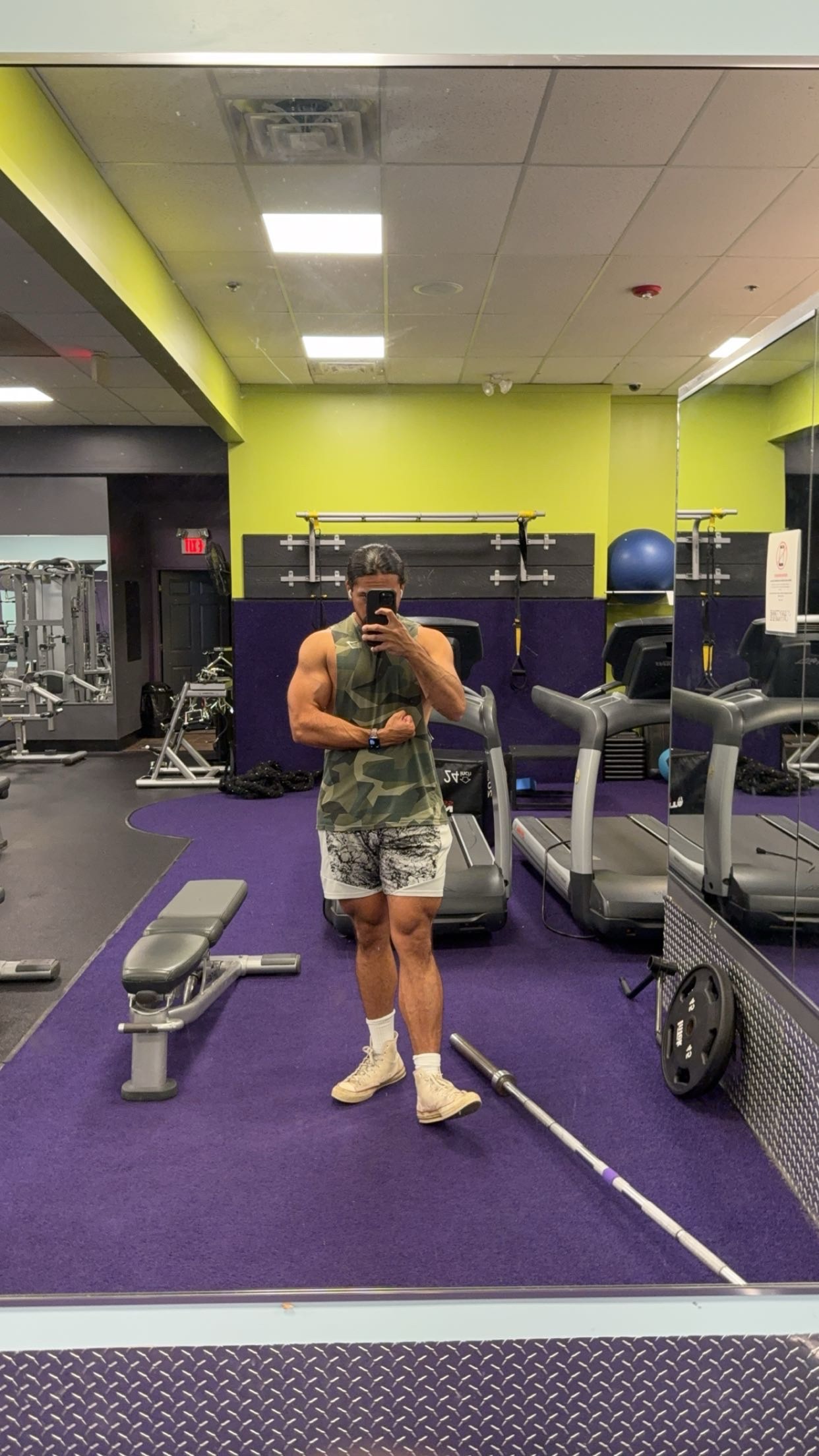 Jayden taking a progress photo at the gym